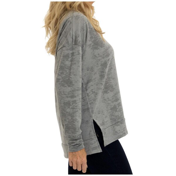 side view of model wearing women's gray tie dye crew neck sweatshirt with drop tail hem